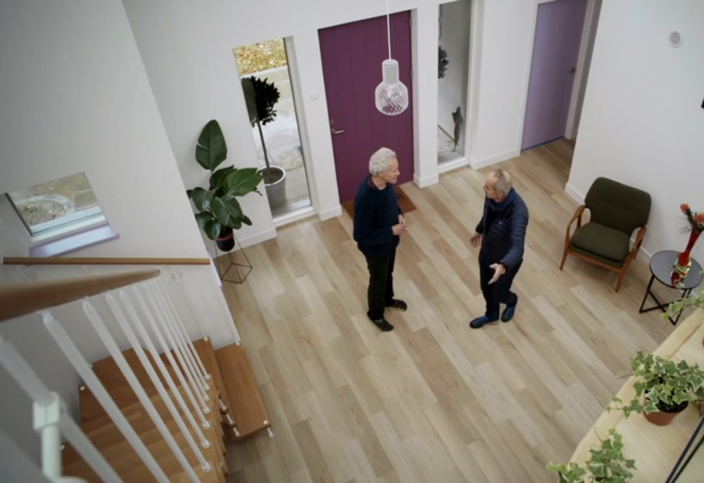 Tony showing his hallway to Kevin McCloud